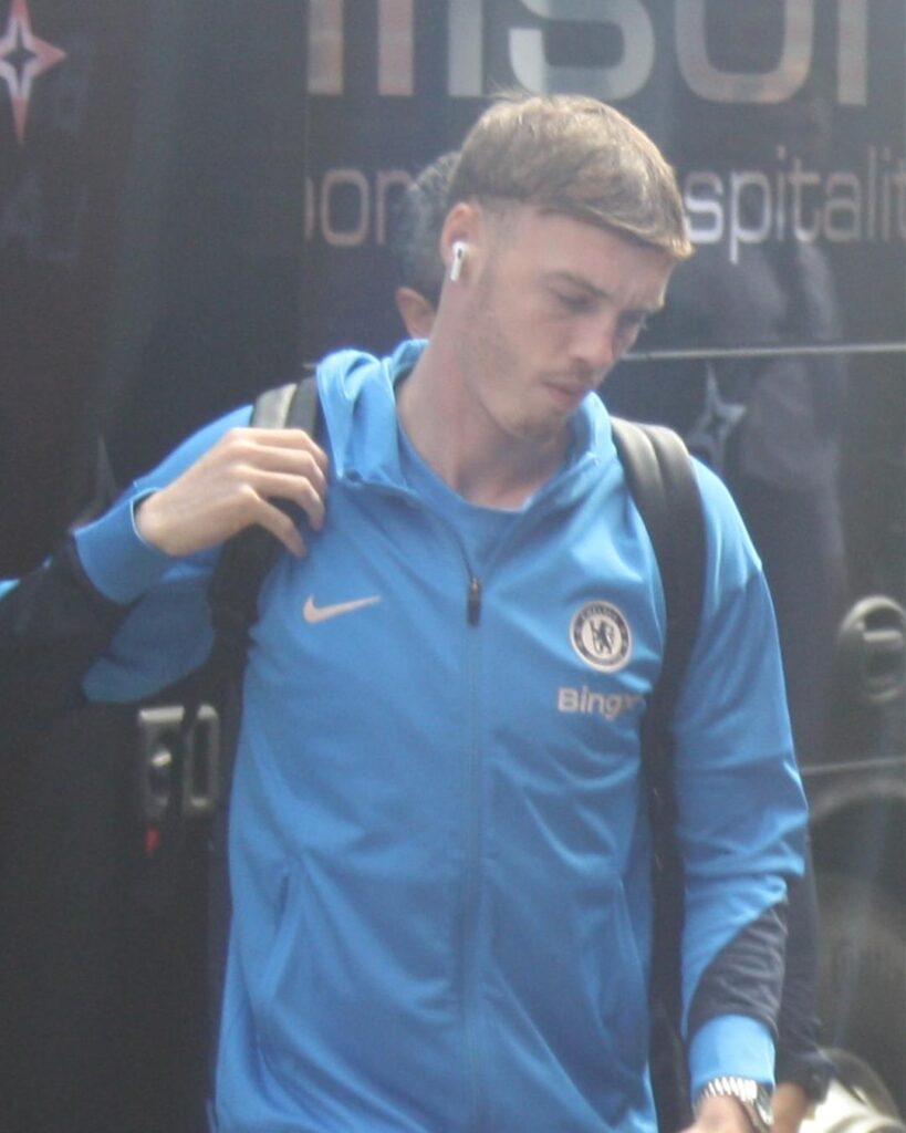 Cole Palmer in a blue Chelsea training jacket arriving for a Premier League game in April 2025