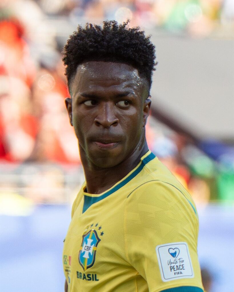 Vinicius Junior in Brazil's yellow shirt, looking over his shoulder during a World Cup game