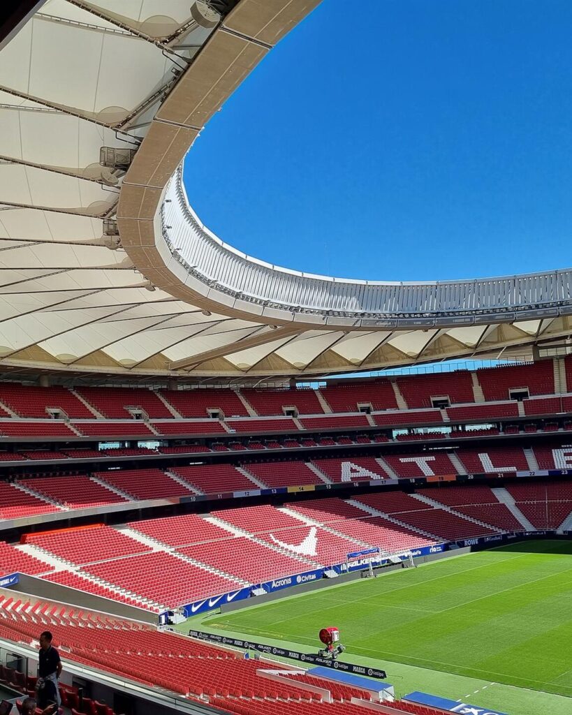 Red seats and the roof inside Atletico Madrid's Metropolitano stadium
