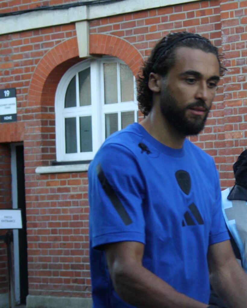 Dominic Calvert-Lewin wearing a headband and a blue Leeds shirt before an away game
