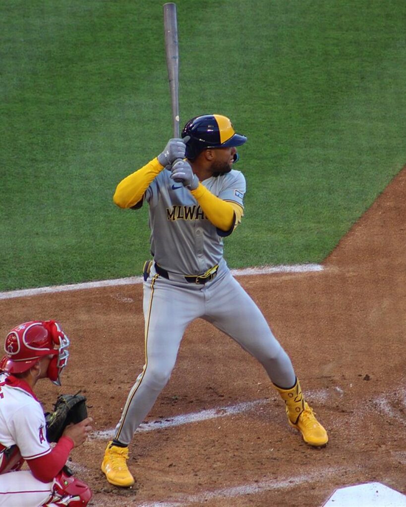 Jackson Chourio at bat in a grey Milwaukee road uniform