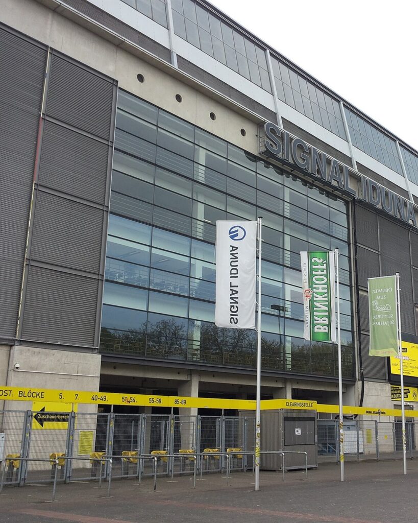 The front of Signal Iduna Park in Dortmund with the stadium name on the wall