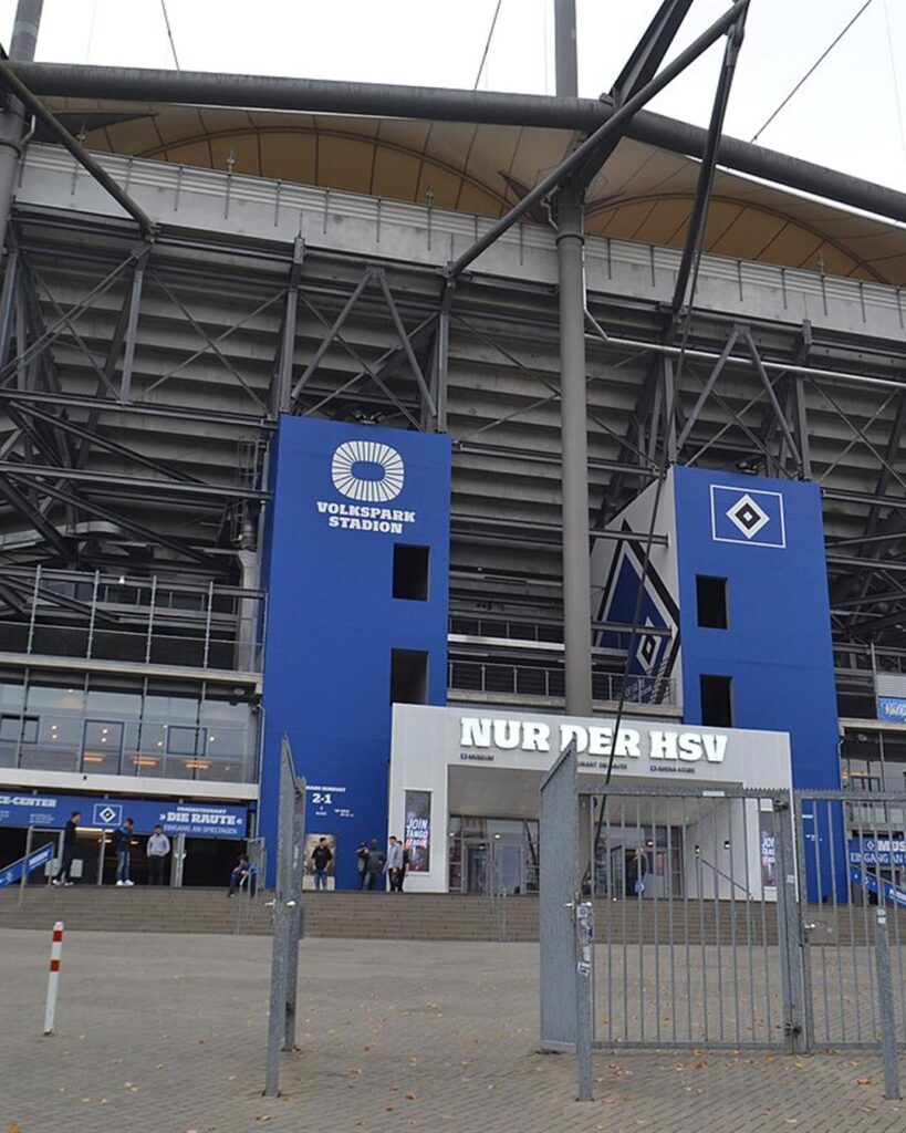 The main entrance of the Volksparkstadion in Hamburg with the HSV logo