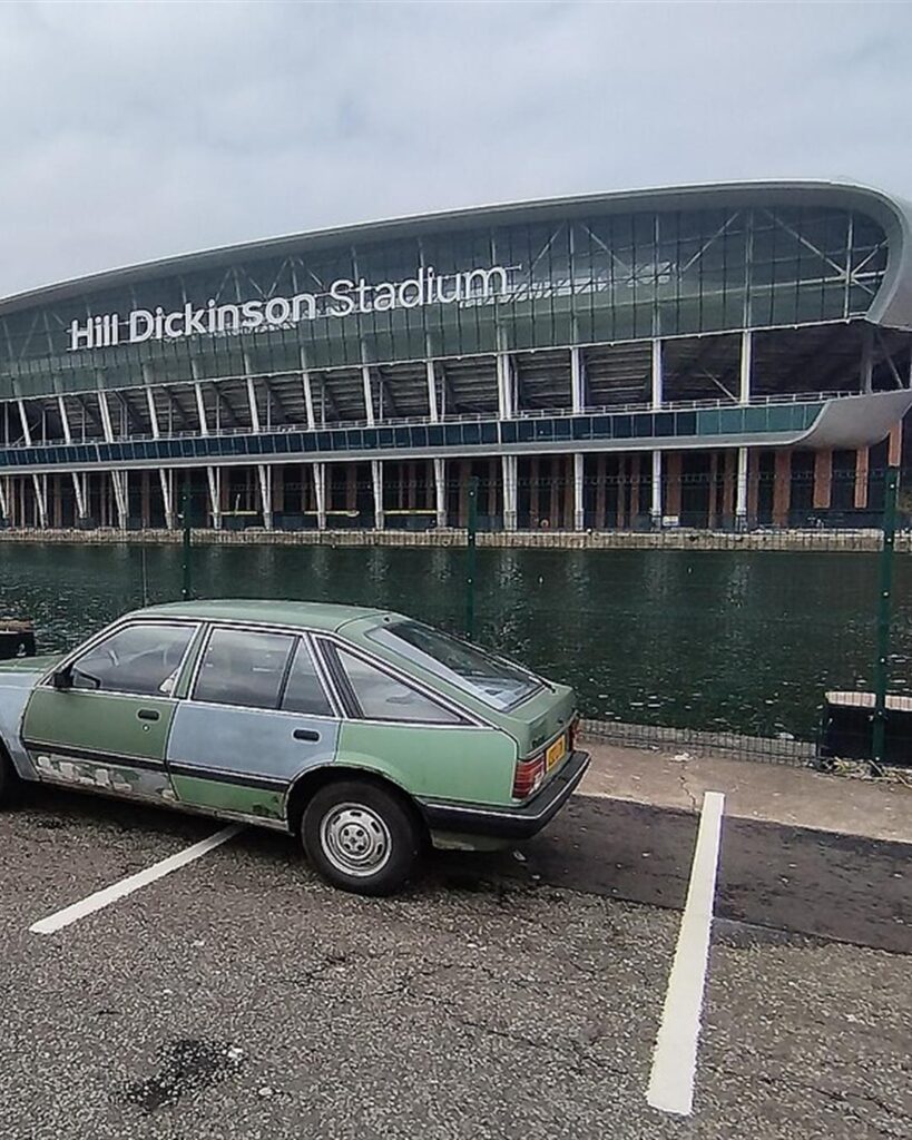 Hill Dickinson Stadium seen across the water from a car park