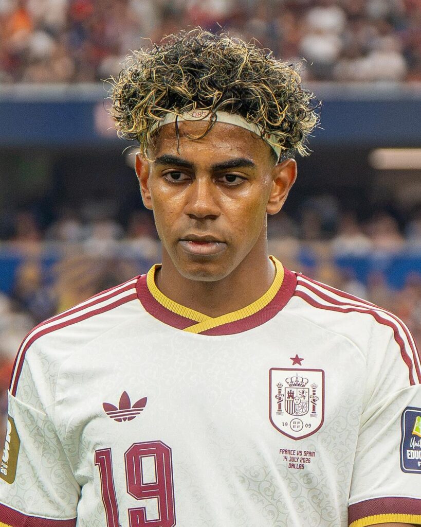 Lamine Yamal in a white Spain shirt with number 19, before a match