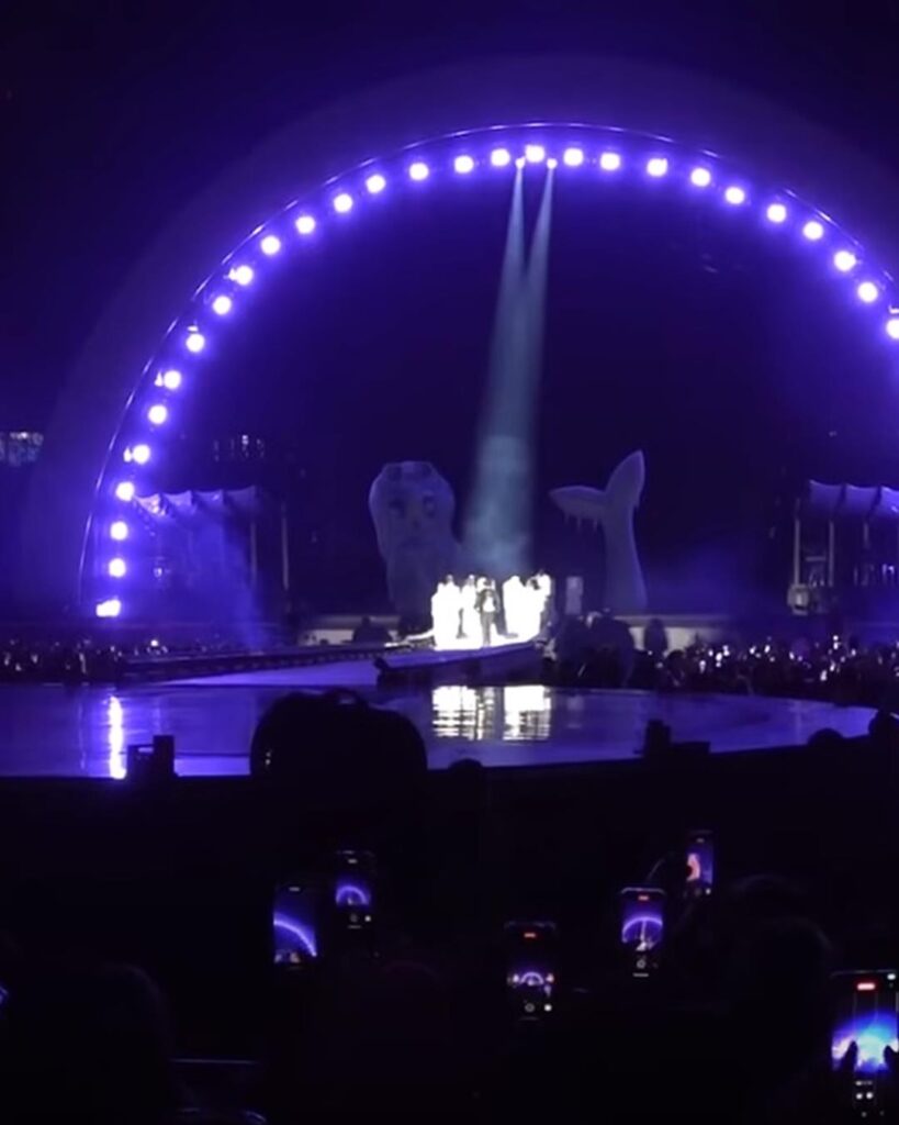 Karol G's concert stage in El Salvador under a ring of purple lights