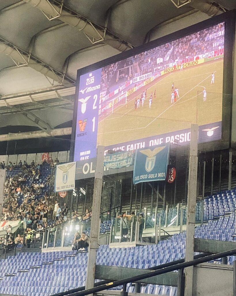 The big screen and Lazio flags at the Stadio Olimpico in Rome
