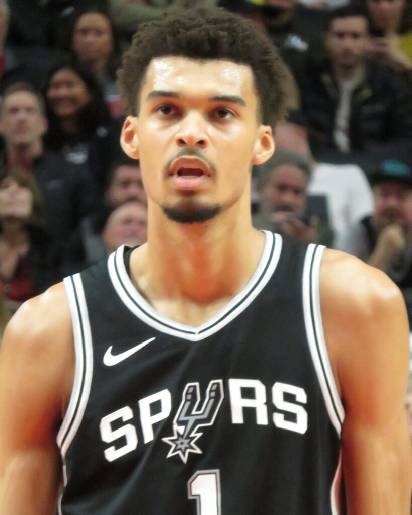 Victor Wembanyama in a black Spurs number 1 jersey, close-up during a game